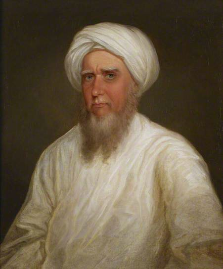 Hugh Seton as a traveller wearing Eastern costume of a white turban and gown.